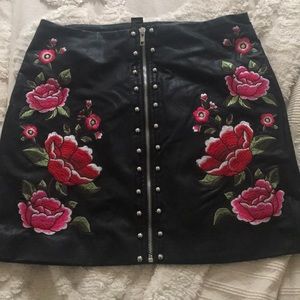 Leather skirt with floral and stud embellishment
